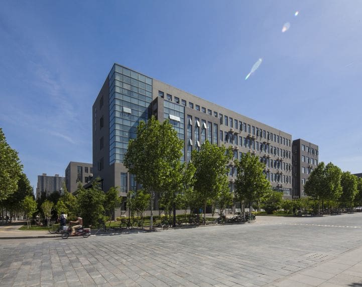 A large building with trees in front of it