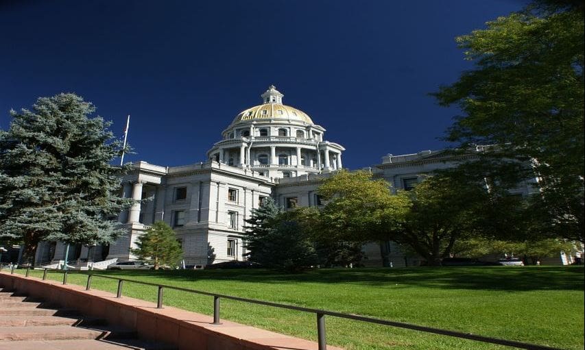 A large building with trees in front of it