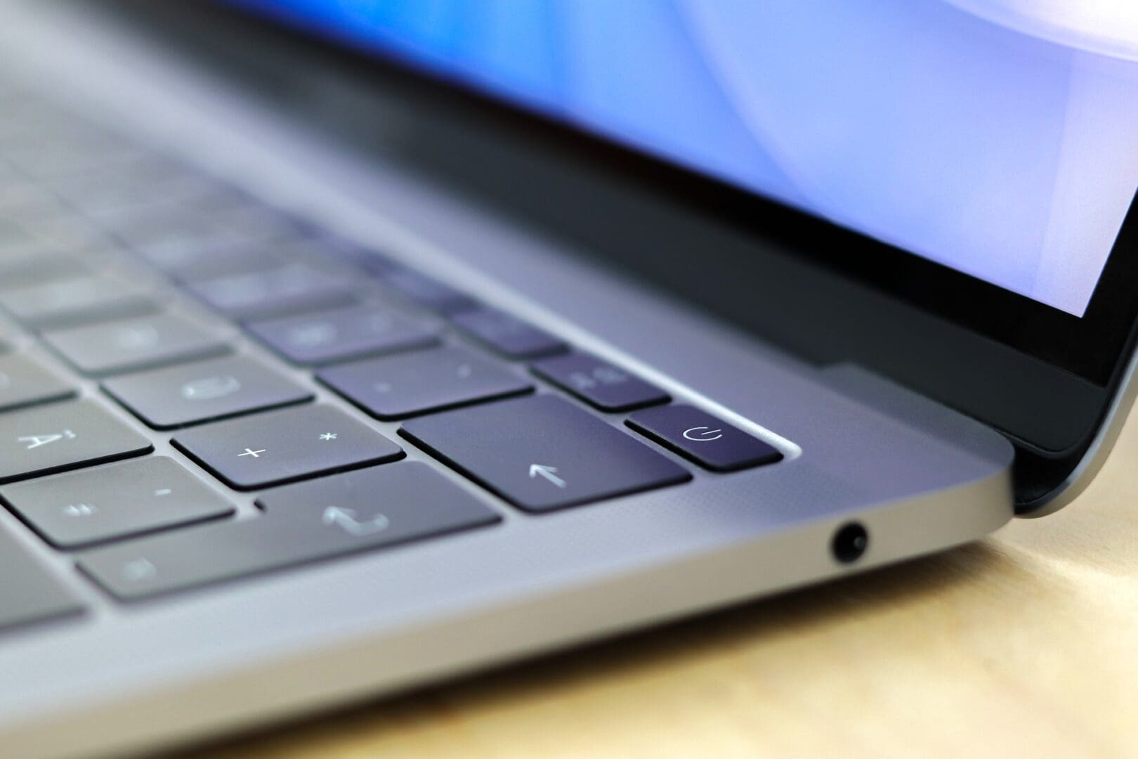 A close up of the keyboard on an apple laptop